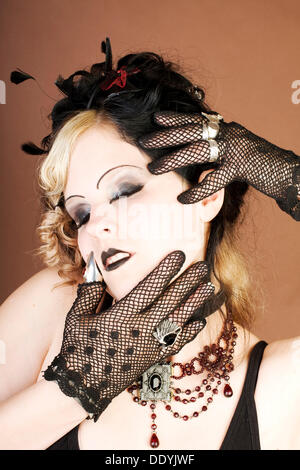 Woman, Gothic, holding her head Stock Photo