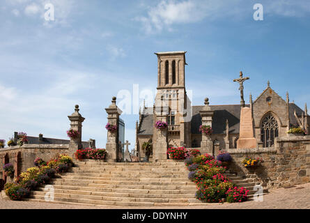 Church of Louannec with a cemetery and the typical Calvaire or Calvary sculpture, Louannec, Brittany, France, Europe Stock Photo