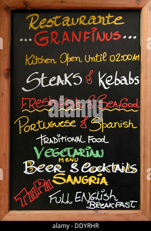 Restaurant menu board showing different dishes available in English in Algarve the southernmost region of Portugal Stock Photo