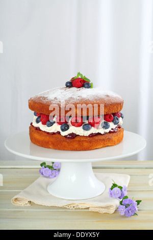 Victoria Sponge Cake with raspberry jam and whipped cream , generously ...