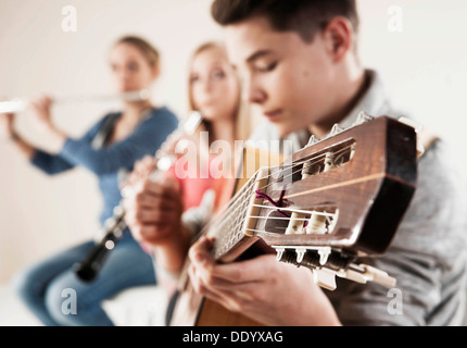 Teenagers making music together Stock Photo