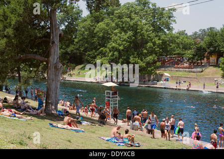People hanging out at Barton Springs in Austin Texas. Stock Photo