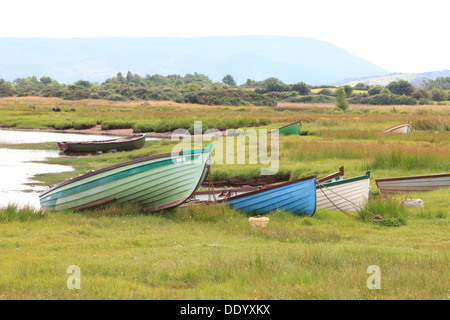 Moored colorful wooden fishing boats along Lough Mask in Tourmakeady, Ireland