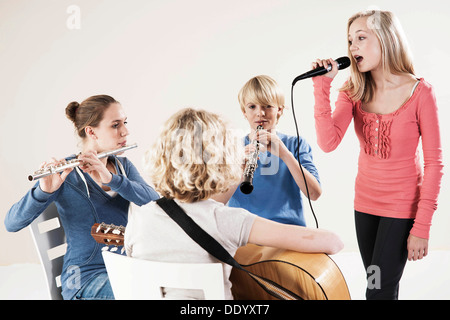 Teenagers making music together Stock Photo