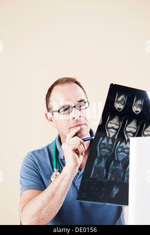 Doctor looking at an X-ray Stock Photo