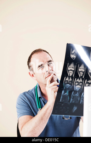 Doctor looking at an X-ray Stock Photo