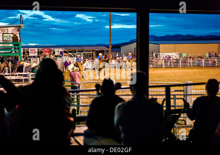 Spectators at dusk watch Chaffee County Fair & Rodeo, Poncha Springs, Colorado, USA Stock Photo