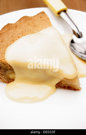 Apple pie and custard a traditional British dessert Stock Photo