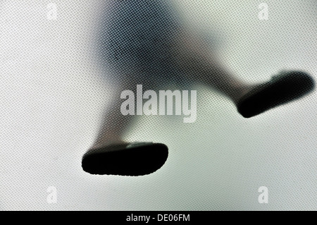 Anonymous walking person from below Stock Photo