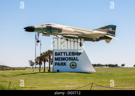 F4 Phantom jet mounted on sign at entrance to the Battleship Memorial Park, home of the USS Alabama in Mobile, Alabama Stock Photo