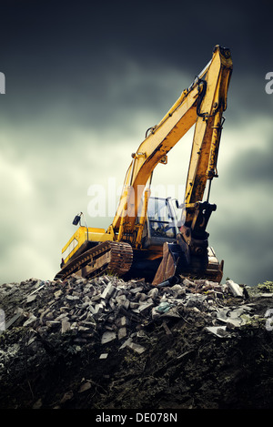 Large Machines In Action Excavator during excavation at construction site. Backhoe on Earthworks ...