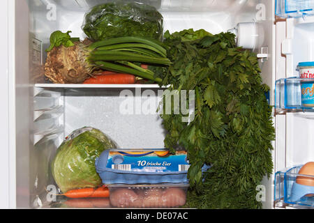 Food stored in the wrong place in a fridge Stock Photo