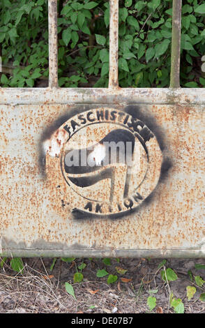 Stencil of 'Antifaschistische Aktion' on a gate sprayed over by right-wing supporters, Oranienburg, Brandenburg Stock Photo