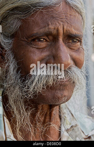 Portrait of an old gray haired indian woman at the Otavallo market in ...