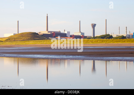 Sellafield nuclear power station reflected in a pool on the sea shore in front Cumbria England United Kingdom Great Britain Stock Photo