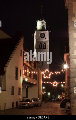 Alleyway decorated with Christmas lights, St. Nikolaus parish church at back, Ueberlingen, Lake Constance district Stock Photo