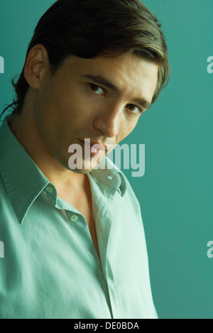 Attractive man looking seductively at camera Stock Photo
