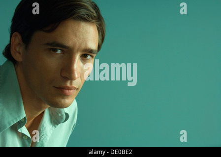 Man confidently looking at camera, portrait Stock Photo