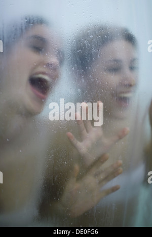 Two young women having fun in bathroom Stock Photo