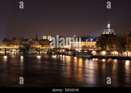 France, Paris, Seine River illuminated at night Stock Photo