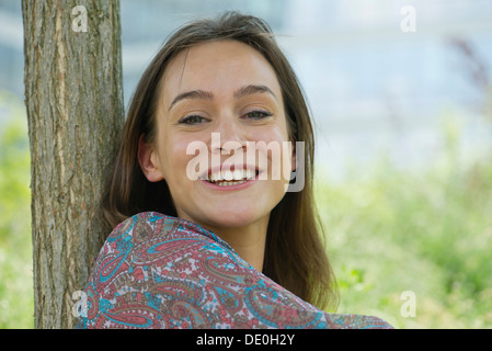 Woman smiling outdoors, portrait Stock Photo