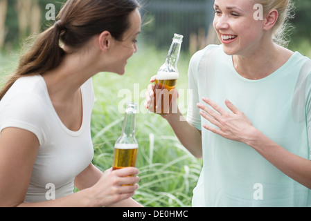 Women drinking beer together Stock Photo