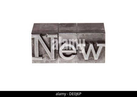 Old lead letters forming the word New Stock Photo