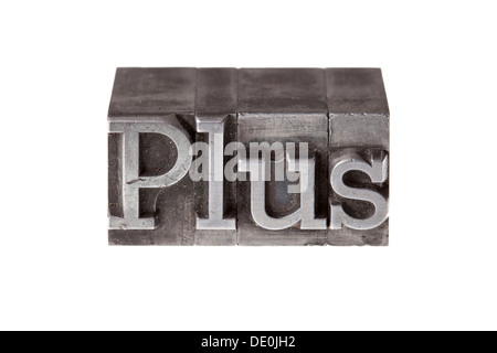 Old lead letters forming the word "Plus" Stock Photo