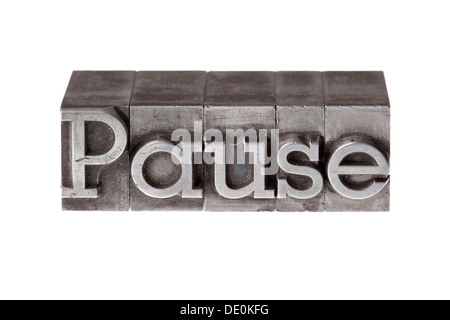 Old lead letters forming the word "Pause" Stock Photo