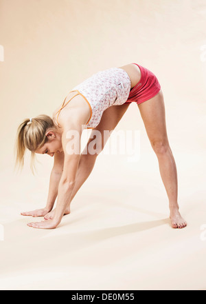 Young woman stretching Stock Photo