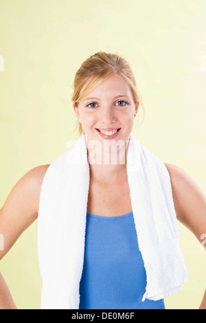 Smiling young woman after doing sport Stock Photo