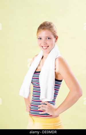 Smiling young woman after doing sport Stock Photo