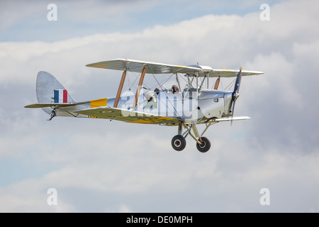 De Havilland Tiger Moth biplane in flight, side view Stock Photo