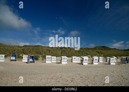 Dunes and roofed wicker beach chairs, Sylt, Northern Friesland, North Frisia, Schleswig-Holstein Stock Photo