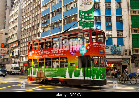 Double-deck tramcar of Hong Kong Tramways with tram body advertising, Hong Kong Stock Photo