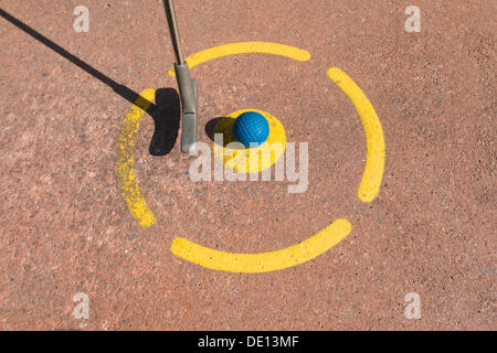 Mini golf, tee, golf ball, golf club Stock Photo