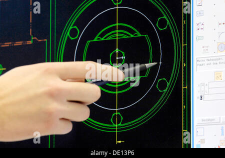 Hand pointing to a technical drawing on a monitor, CAD draftsman Stock Photo