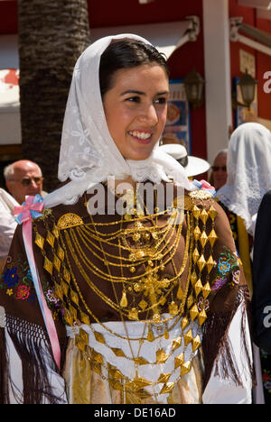 Young woman wearing typical costume and traditional gold jewelry called Emprendada, Ibiza, Spain, Europe Stock Photo