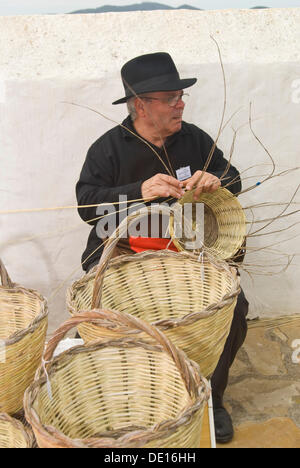 Man making baskets at the Santa Eulalia yearly traditional handicrafts fair, Santa Eulalia, Ibiza, Spain, Europe Stock Photo