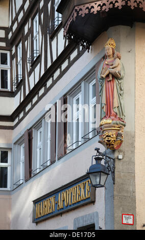 Figure of the Virgin Mary at St. Mary's Pharmacy, Herrngasse Street, market square, Rothenburg ob der Tauber, Bavaria Stock Photo