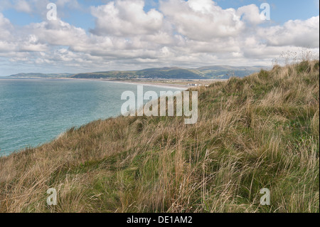 Scenic coastal view across Ceredigion Bay of Dovey River from Borth headland and Snowdon national park mountain range on skyline Stock Photo
