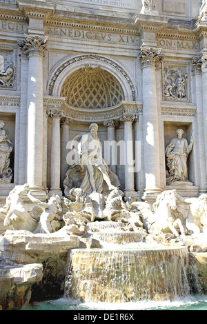 detail of the fountain of trevi in Rome with the statue of the God Neptune in white marbl