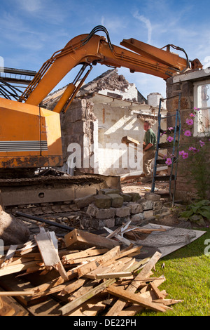 self building house, demolishing old stone built outbuilding to clear site ready for building new house Stock Photo