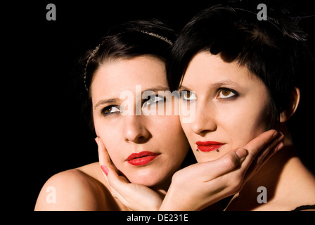 Two young women looking into the distance Stock Photo