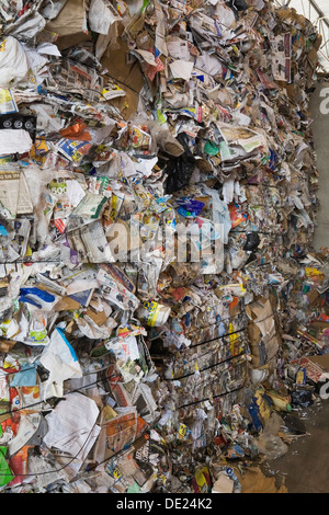 Stacked bales of recyclable cardboard and paper at a sorting centre, Quebec, Canada Stock Photo