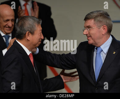 Buenos Aires, Argentina. 10th Sep, 2013. Ng Ser Miang of Singapore (2nd L) congratulates Germany's Thomas Bach (R) after his election as new IOC President at the Hilton hotel in Buenos Aires, Argentina, 10 September 2013. Bach is the ninth IOC President. Photo: Arne Dedert/dpa/Alamy Live News Stock Photo