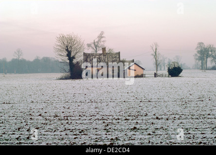 Cottage in a snowy field, Eye, Suffolk. Artist: Tony Evans Stock Photo