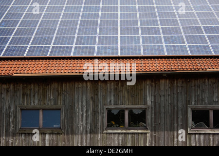 Solar power system on an old hut Stock Photo