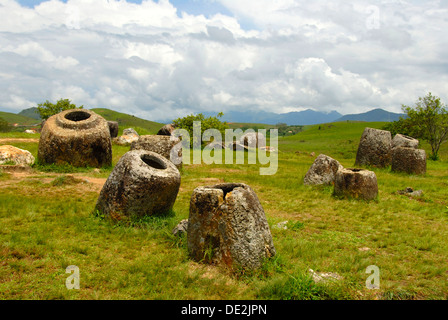 Archeology, ancient stone jars in the landscape, Jar Site 1, Hai Hin Phu Salato, Plain of Jars, near Phonsavan Stock Photo