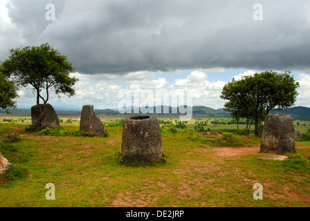 Archeology, ancient stone jars in the landscape, Jar Site 2, Hai Hin Phu Salato, Plain of Jars, near Phonsavan Stock Photo